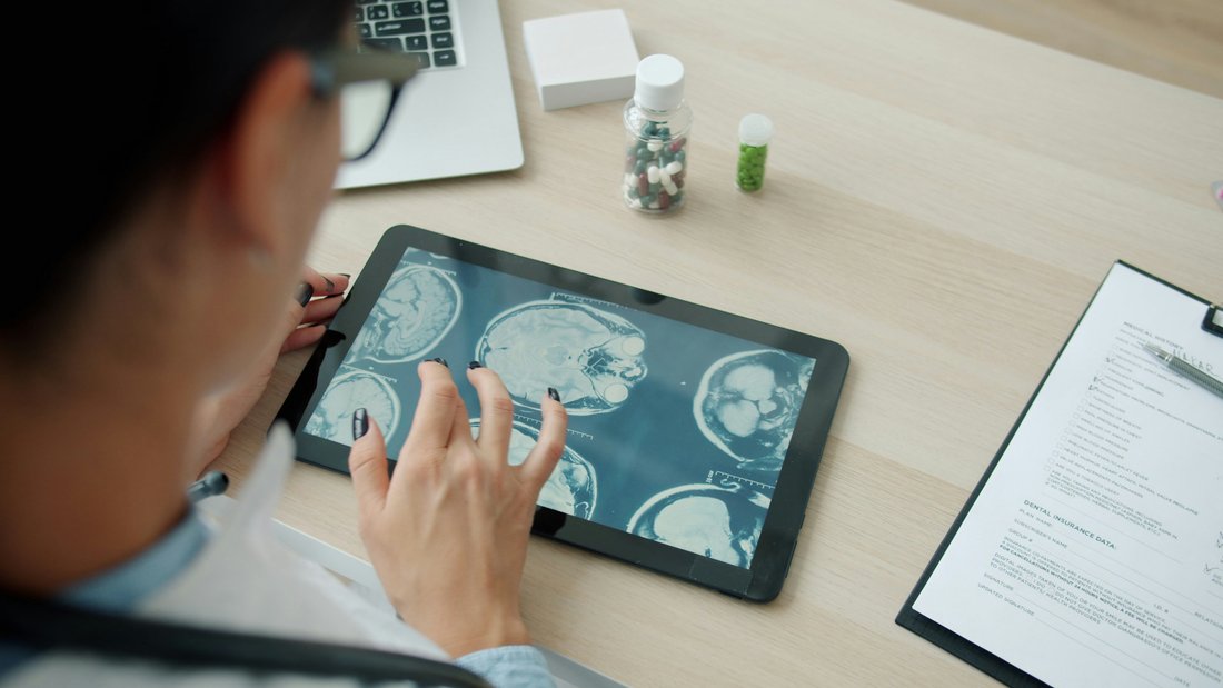 A provider reviewing scans on a tablet